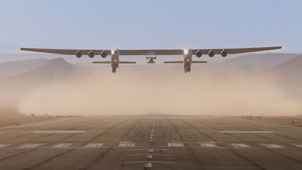 The six-engined Roc aircraft takes off with the Talon-A-1 test vehicle attached beneath its wings.