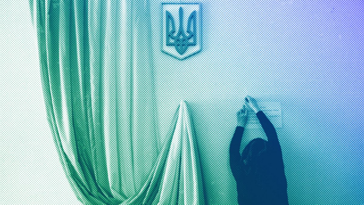 A volunteer makes preparations at a polling station ahead of Sunday