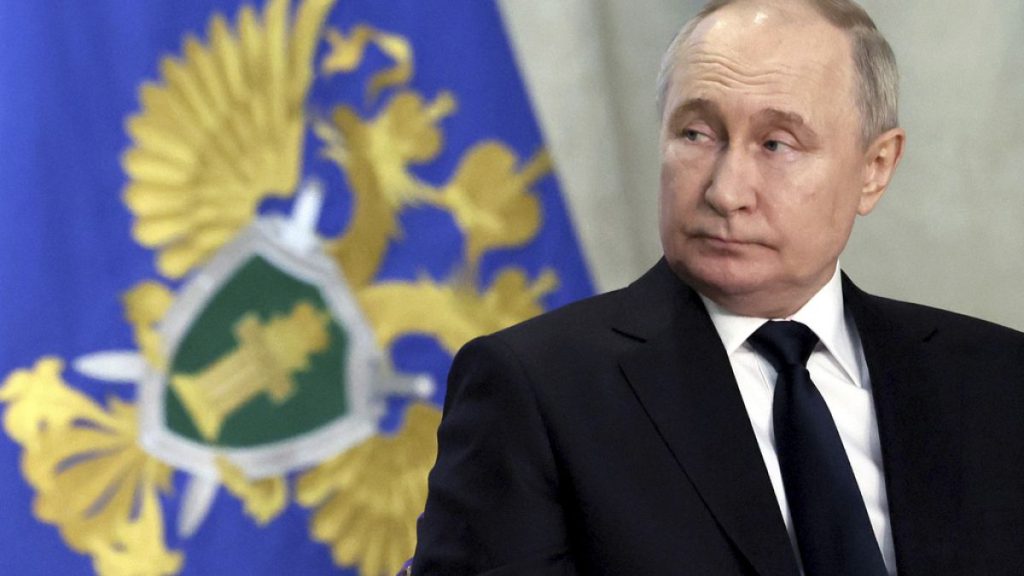 Russian President Vladimir Putin attends an expanded meeting of the Prosecutor General
