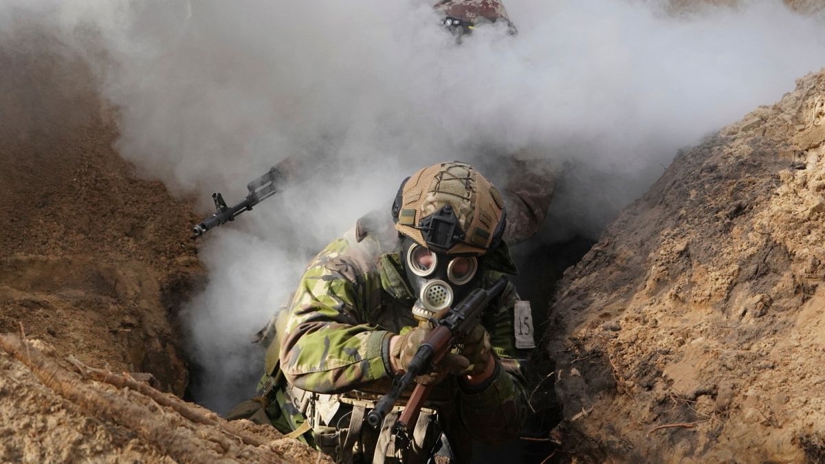 Ukrainian National guard soldiers simulate assault operations during tactical training at a shooting range in Kharkiv region, Ukraine, on Thursday, Feb. 29, 2024.