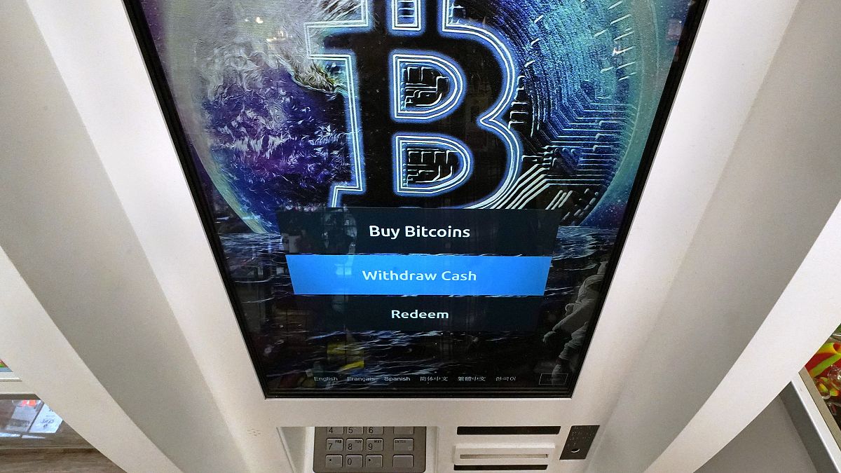 The Bitcoin logo appears on the display screen of a cryptocurrency ATM in Salem, N.H., Feb. 9, 2021.