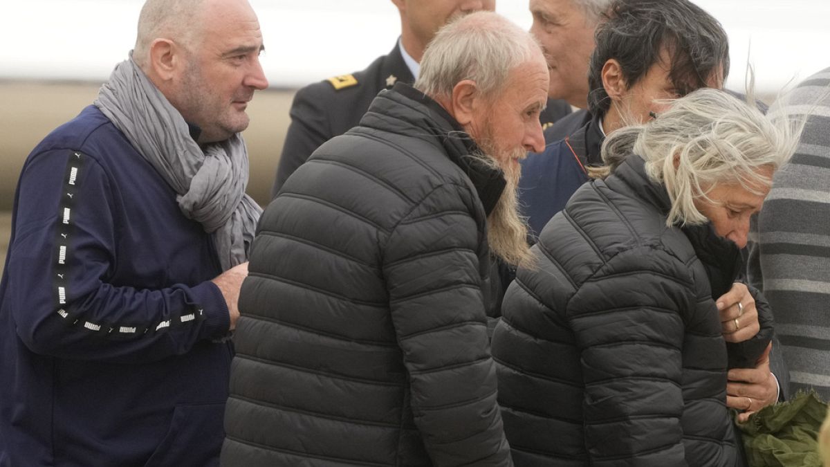 Rocco Antonio Langone, centre, his wife Maria Donata Caivano and his son Giovanni arrive at Ciampino at military airport, in Rome, Tuesday, 27 February, 2024.