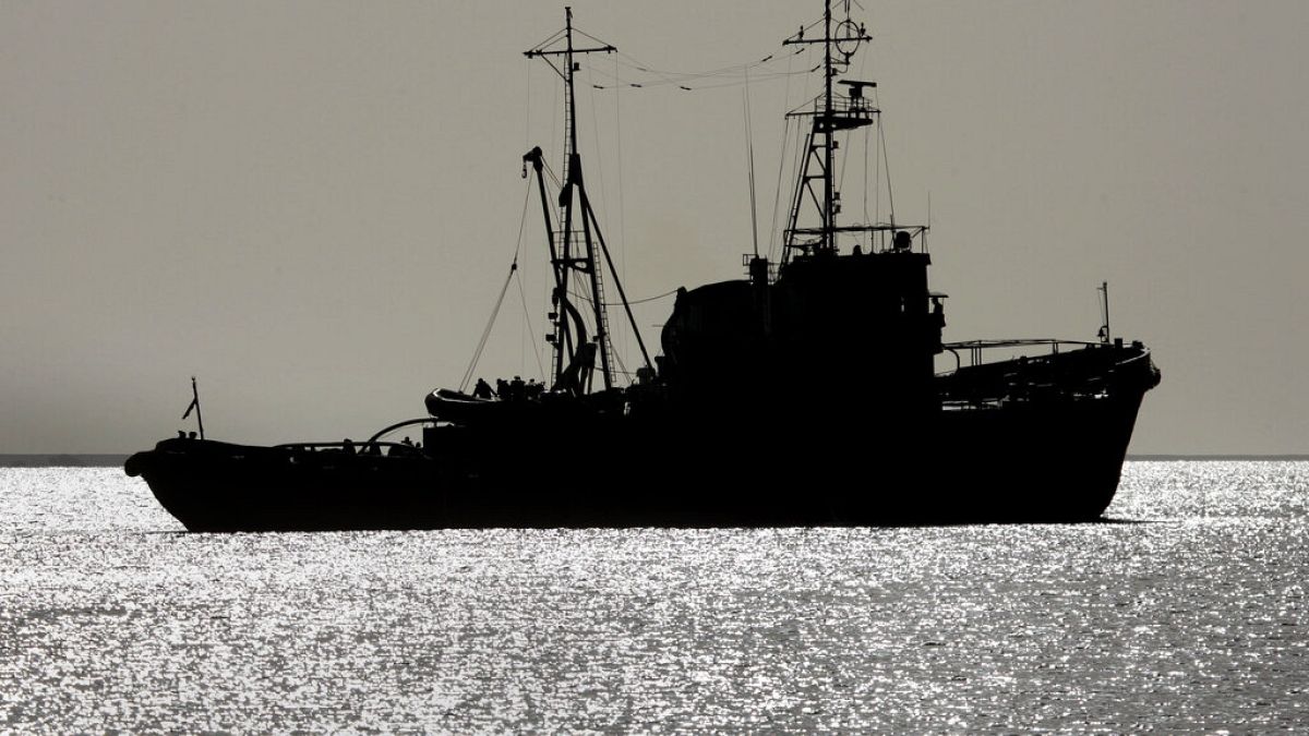 An Egyptian naval vessel used in the rescue sails back out to sea after briefly returning to the dock of Safaga harbour in Egypt Saturday, Feb. 4, 2006