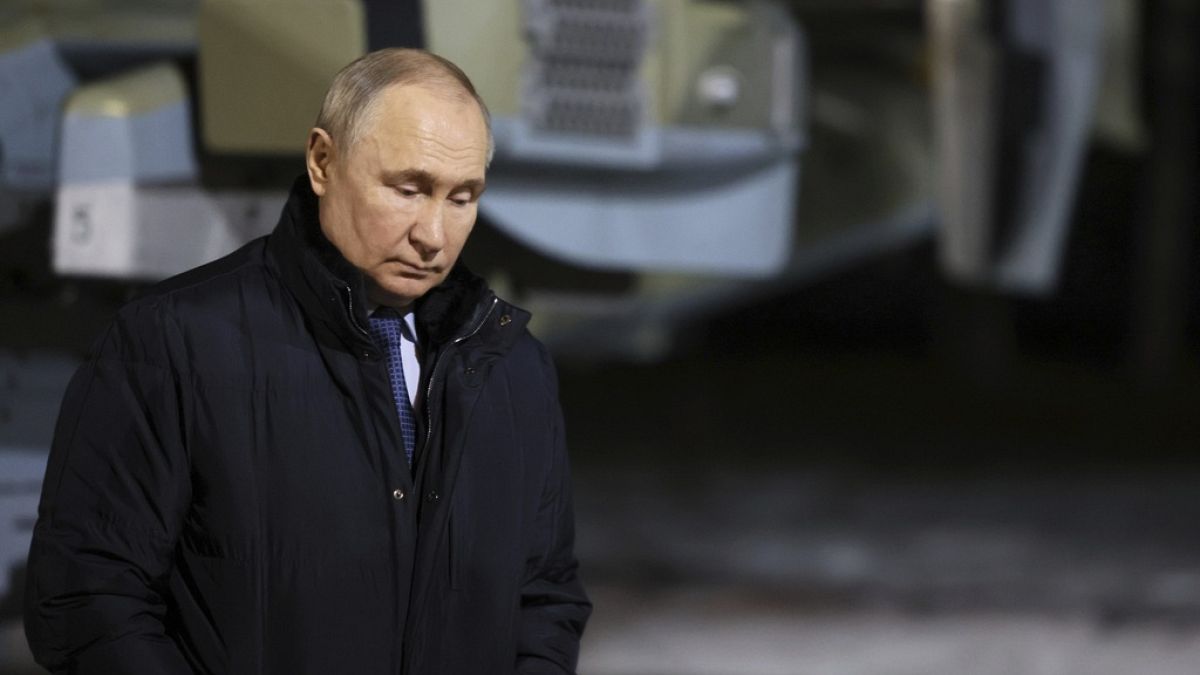 Vladimir Putin stands near a helicopter in Torzhok, Tver region, 217 km (136 miles) north-west of Moscow, Russia, Wednesday, March 27, 2024.