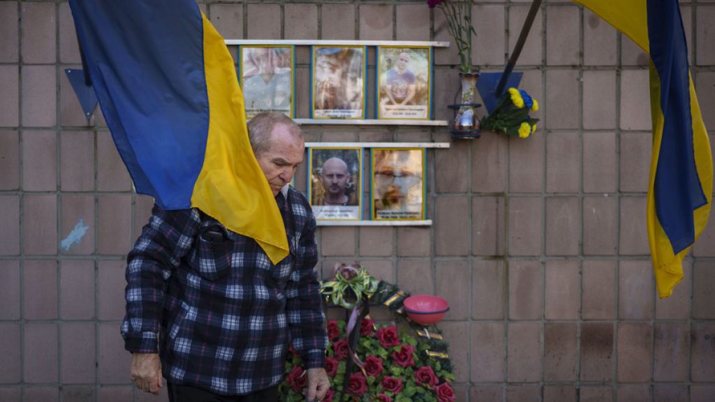 Oleksandr Turovskyi, father of Sviatoslav Turovskyi, leaves after bringing fresh flowers to the place where his son