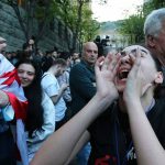 A protester shouts outside the parliament building in Tbilisi, Georgia, on Tuesday, April 16, 2024