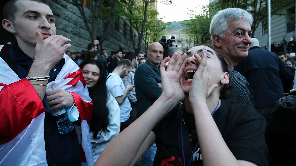 A protester shouts outside the parliament building in Tbilisi, Georgia, on Tuesday, April 16, 2024