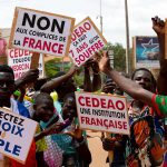 Supporters of military leader Ibrahim Traore protest against France and the West African regional bloc known as ECOWAS in the streets of Ouagadougou, Burkina Faso.