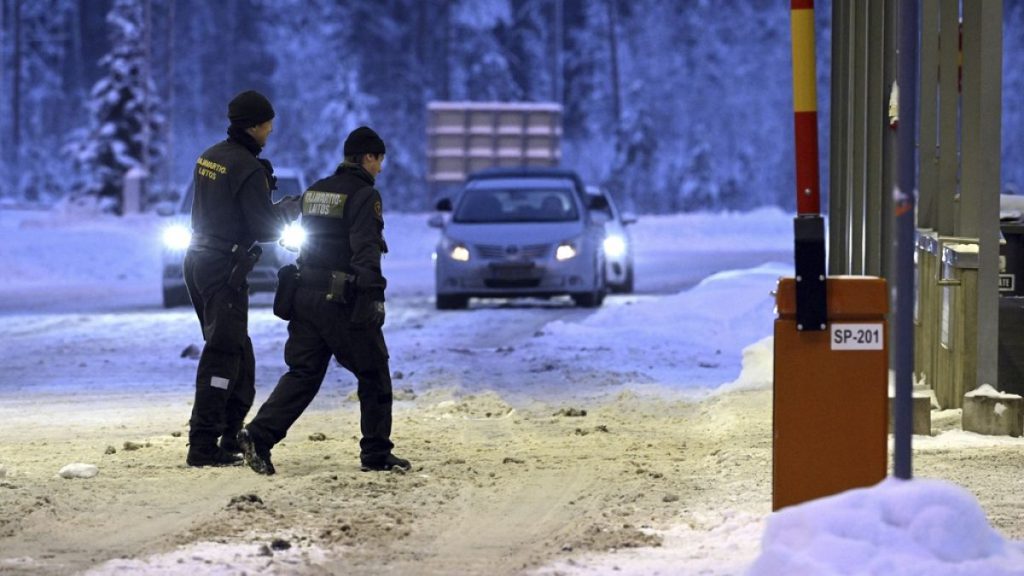 Finnish border guards walk at Vaalimaa border check point between Finland and Russia in Virolahti, Finland, on Dec. 15, 2023.