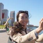 Contented content creator Cynthia Huang Wang works along the Embarcadero in San Francisco, Monday, April 8, 2024.
