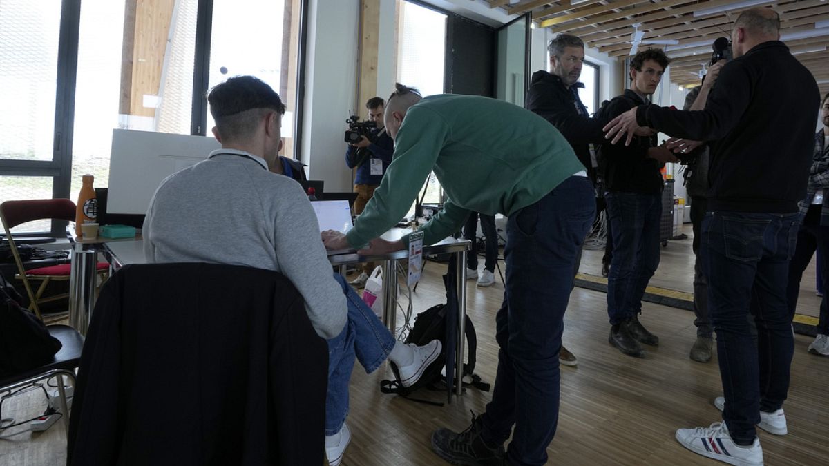 Cyber-security experts work at the Yves du Manoir stadium, Friday, May 3, 2024 in Colombes, outside Paris.