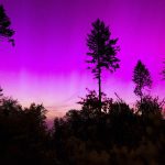 Northern lights appear in the night sky over the Pferdskopf near Treisberg in the Hochtaunus district of Hesse, Germany, early Saturday, May 11, 2024.