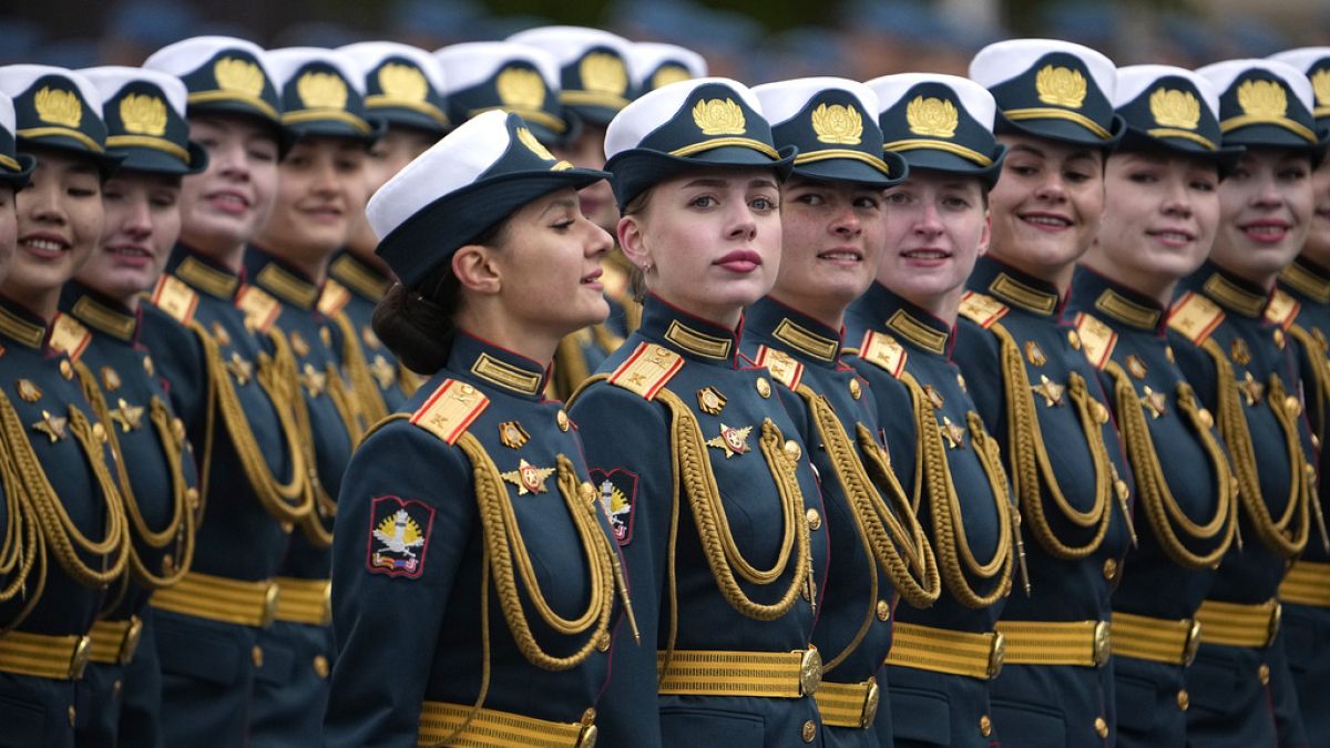 Russian servicewomen march during the Victory Day military parade in Moscow, Russia, Thursday, May 9, 2024.