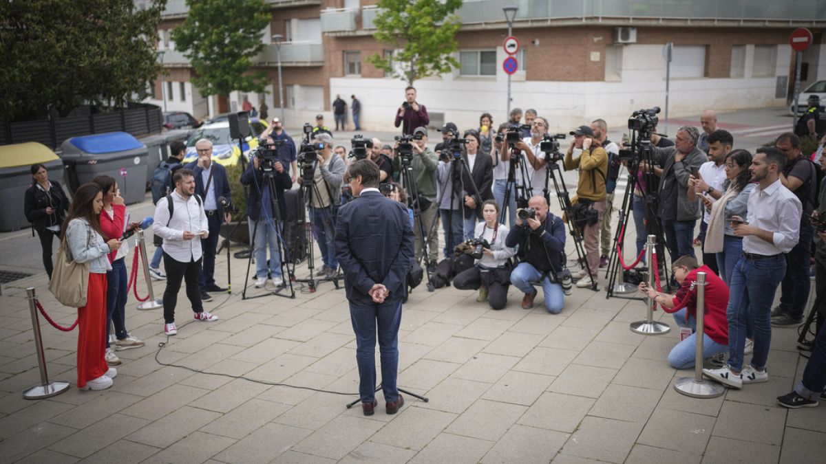 Socialist candidate Salvador Illa talks to journalists after voting at a polling station in La Roca del Valles, north of Barcelona, Sunday May 12, 2024.