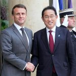 French President Emmanuel Macron, left, shakes hands with Japanese Prime Minister Fumio Kishida before a working lunch, Thursday, May 2, 2024 at the Elysee Palace in Paris.