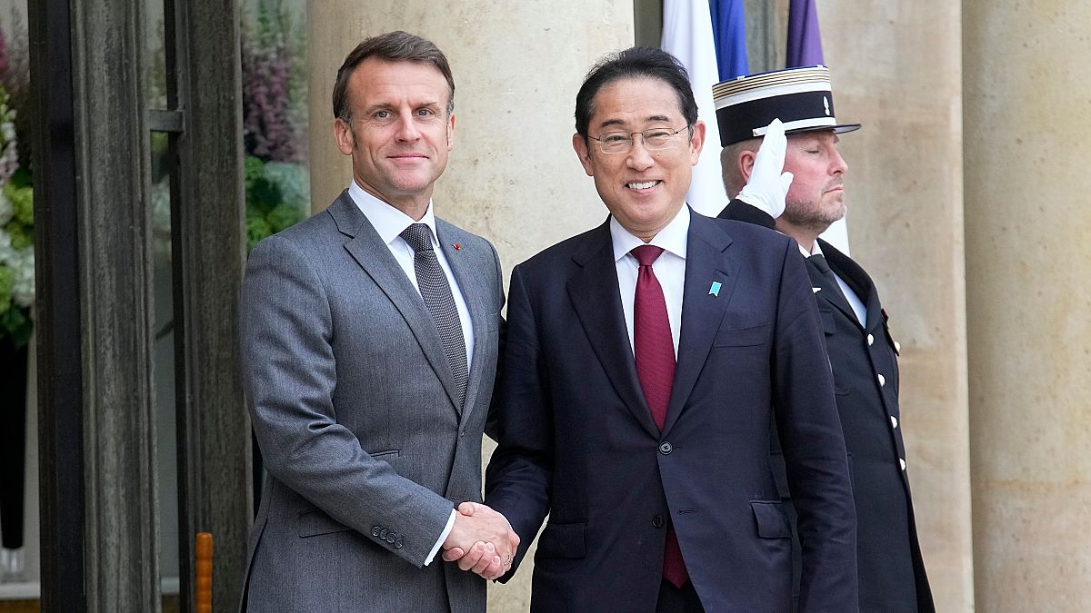 French President Emmanuel Macron, left, shakes hands with Japanese Prime Minister Fumio Kishida before a working lunch, Thursday, May 2, 2024 at the Elysee Palace in Paris.