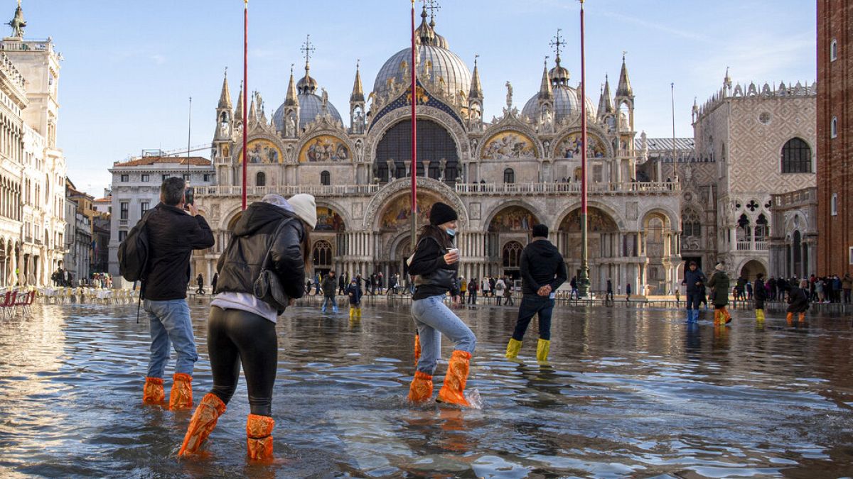 People cross St Mark