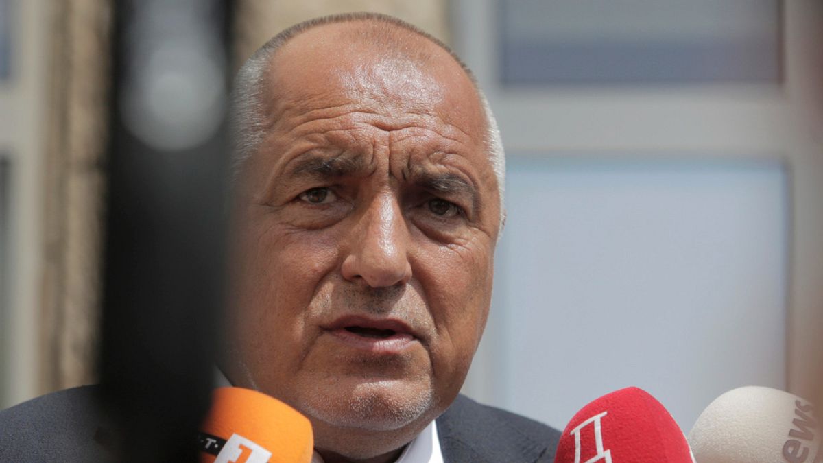 Bulgarian former Prime Minister Boyko Borissov talks to media after casting his vote at a polling station in Bankya, Sunday, June 9, 2024.