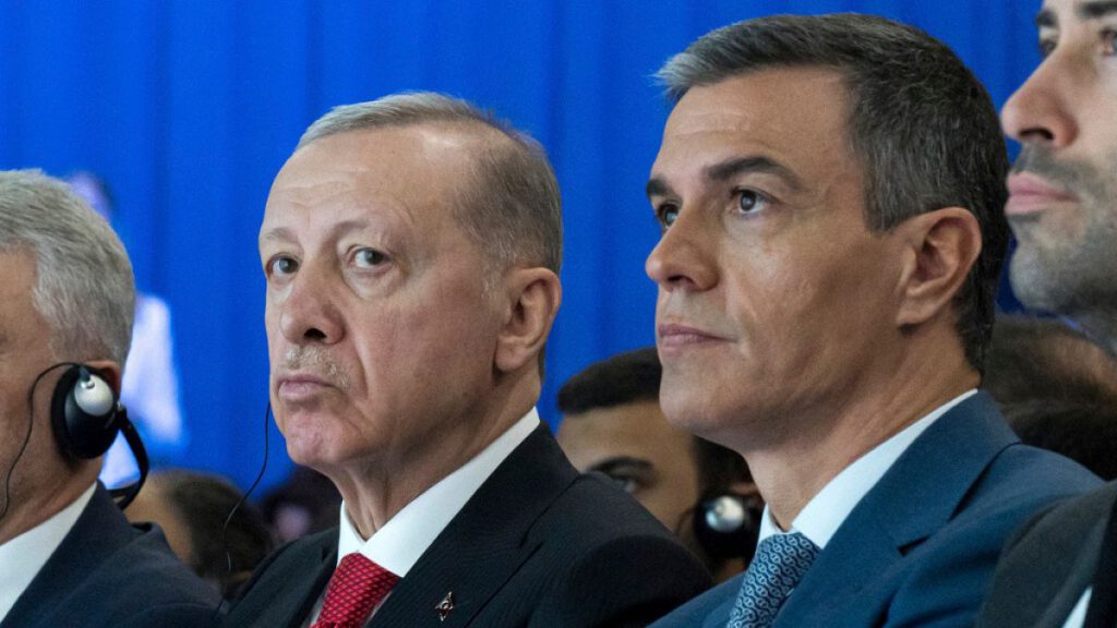 Spanish Prime Minister Pedro Sanchez sits next to Turkish President Recep Tayyip Erdogan, left, during a meeting in Madrid.