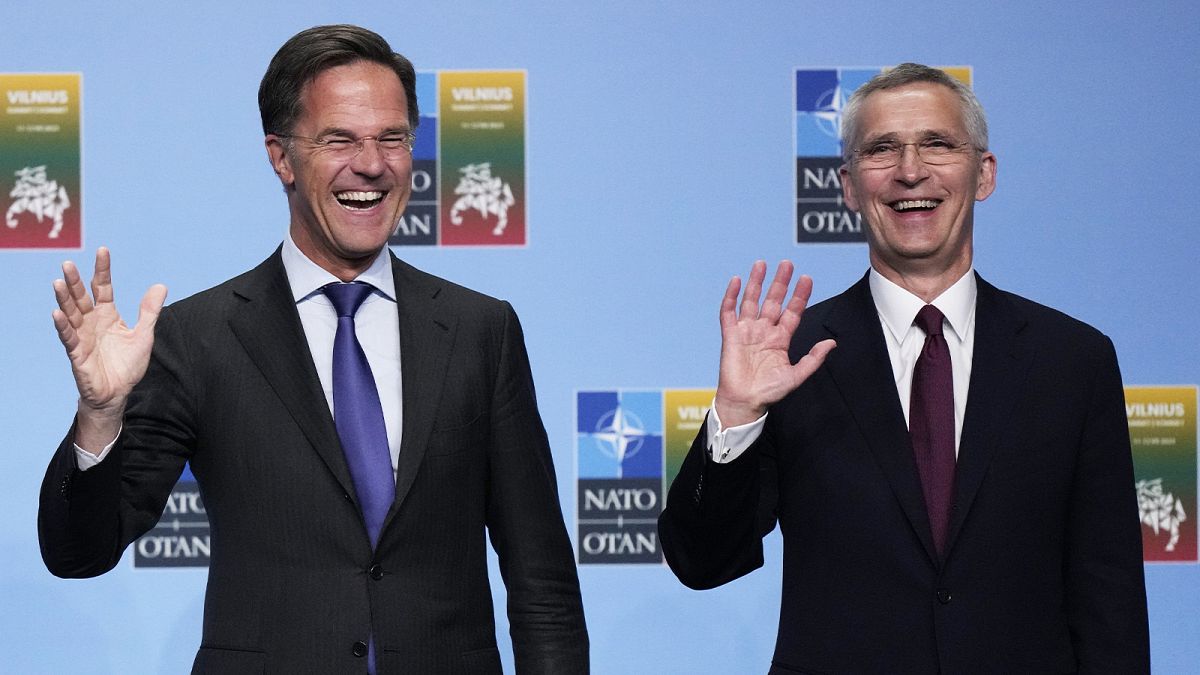 NATO Secretary General Jens Stoltenberg greets Dutch PM Mark Rutte during arrivals for a NATO summit in Vilnius, 11 July 2023