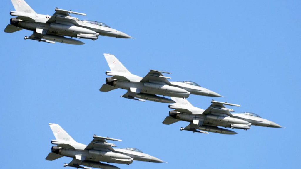 U.S.-made F-16 fighter jets fly in the sky over Poland