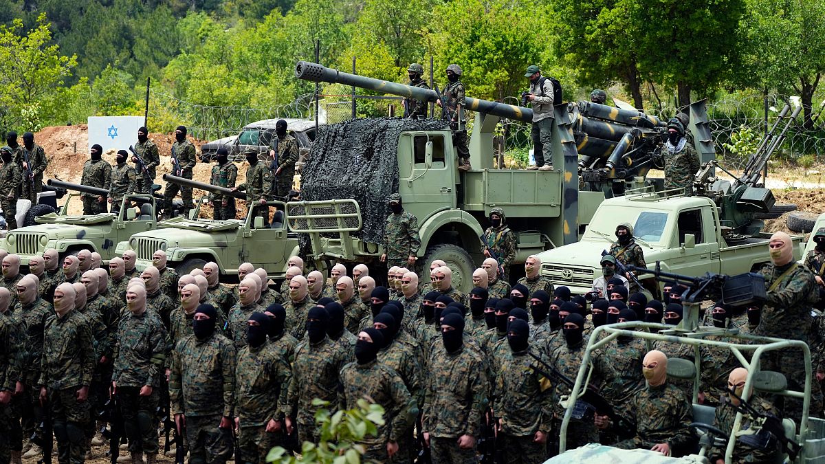 FILE - Fighters from the Lebanese militant group Hezbollah carry out a training exercise in Aaramta village in the Jezzine District, southern Lebanon, Sunday, May 21, 2023.