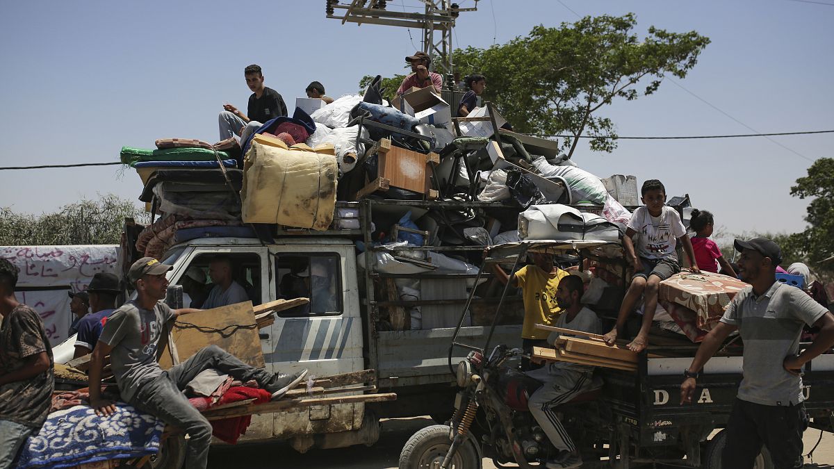 Palestinians arrive in Khan Younis after fleeing an Israeli ground and air offensive in the nearby city of Rafah, June 28, 2024