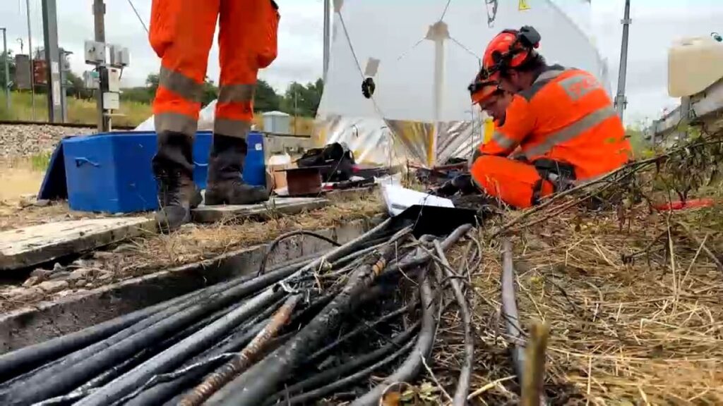 SNCG technicians work on replacing cabling alongside the railway line at Courtalain, July 26, 2024