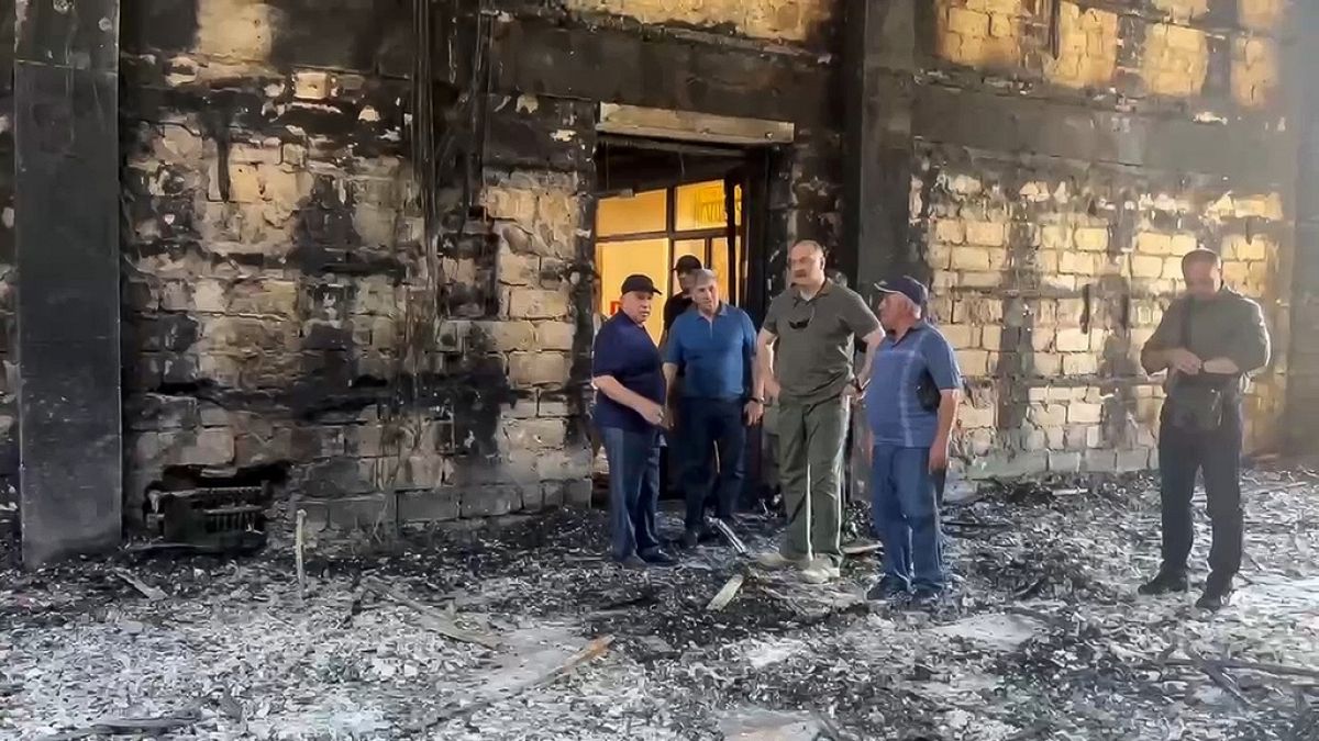 The head of Dagestan Republic Sergei Melikov, center, visits the damaged Kele-Numaz synagogue in Derbent after a counter-terrorist operation in republic of Dagestan, Russia.