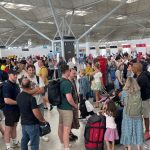 Passengers queueing at London Stansted Airport in Essex, amid reports of widespread IT outages affecting airlines, broadcasters and banks, 19 July, 2024.