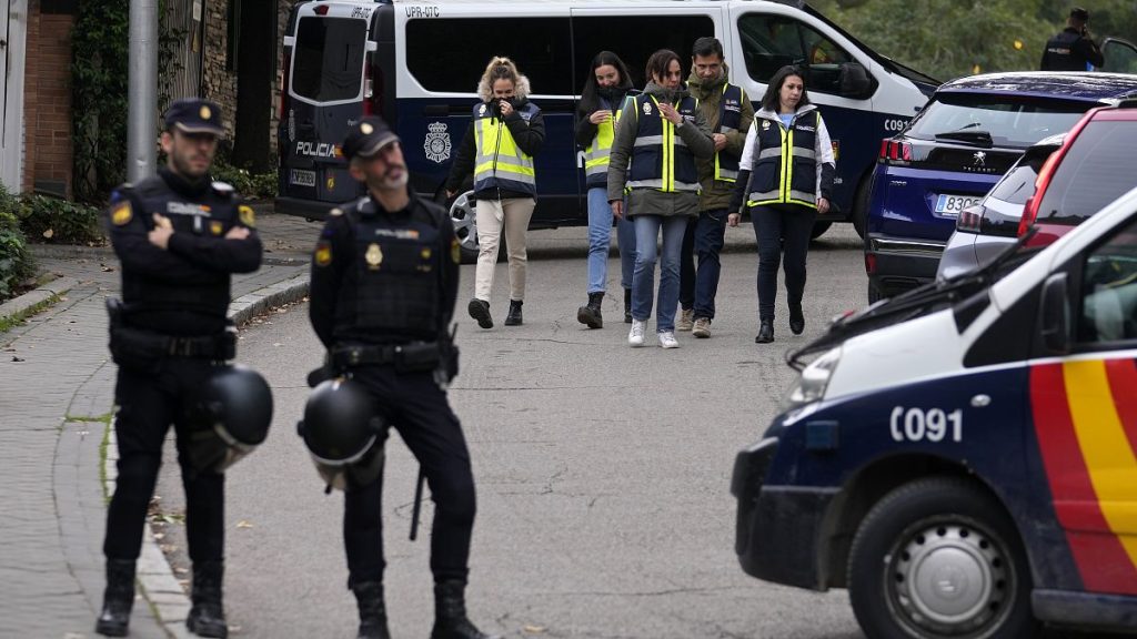 FILE - Police officers stand guard at the cordoned off area next to the Ukrainian embassy in Madrid, on Nov. 30, 2022 following reports of a blast at the Ukrainian embassy