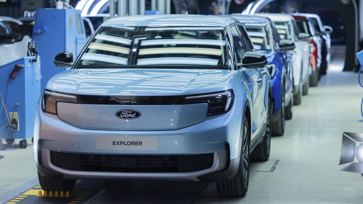 Ford Explorer electric cars stand in the hall at the start of production, in Cologne, Germany, Tuesday June 4, 2024.
