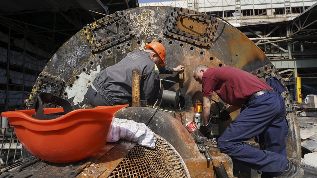 Workers repair damaged thermal power plant, one of the country