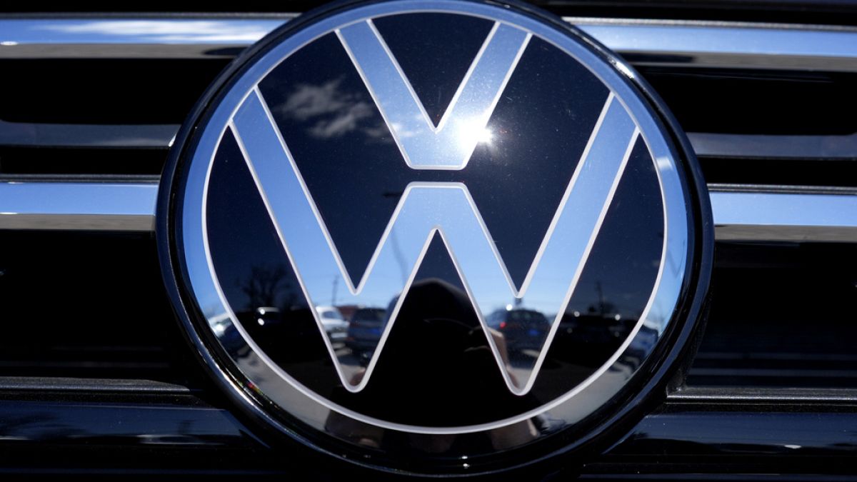 Volkswagen logo is seen at a new and used vehicles dealership in Palatine, Ill., Tuesday, March 20, 2024. (AP Photo/Nam Y. Huh)