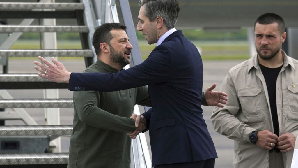 Ukrainian President Volodymyr Zelenskyy is greeted by Irish Taoiseach Simon Harris at Shannon Airport, Ireland, Saturday July 13, 2024.