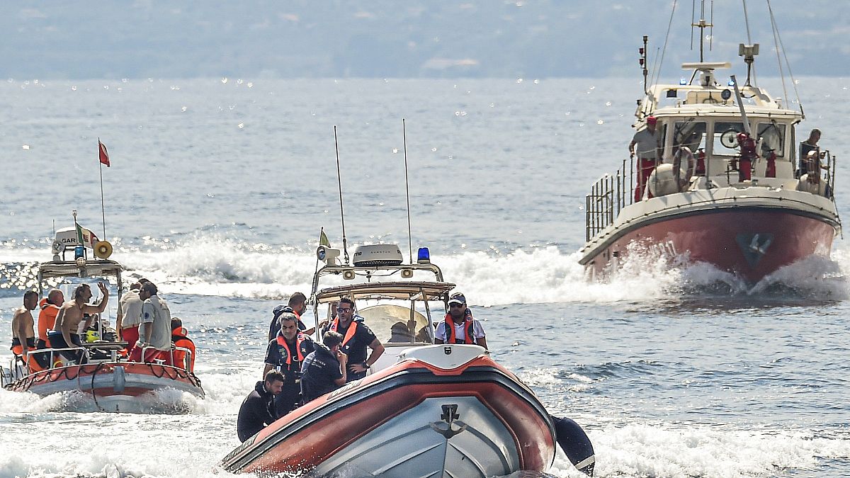 FILE - Italian firefighter divers work at the site of a shipwreck, in Porticello, Sicily, southern Italy, Thursday, Aug. 22, 2024.