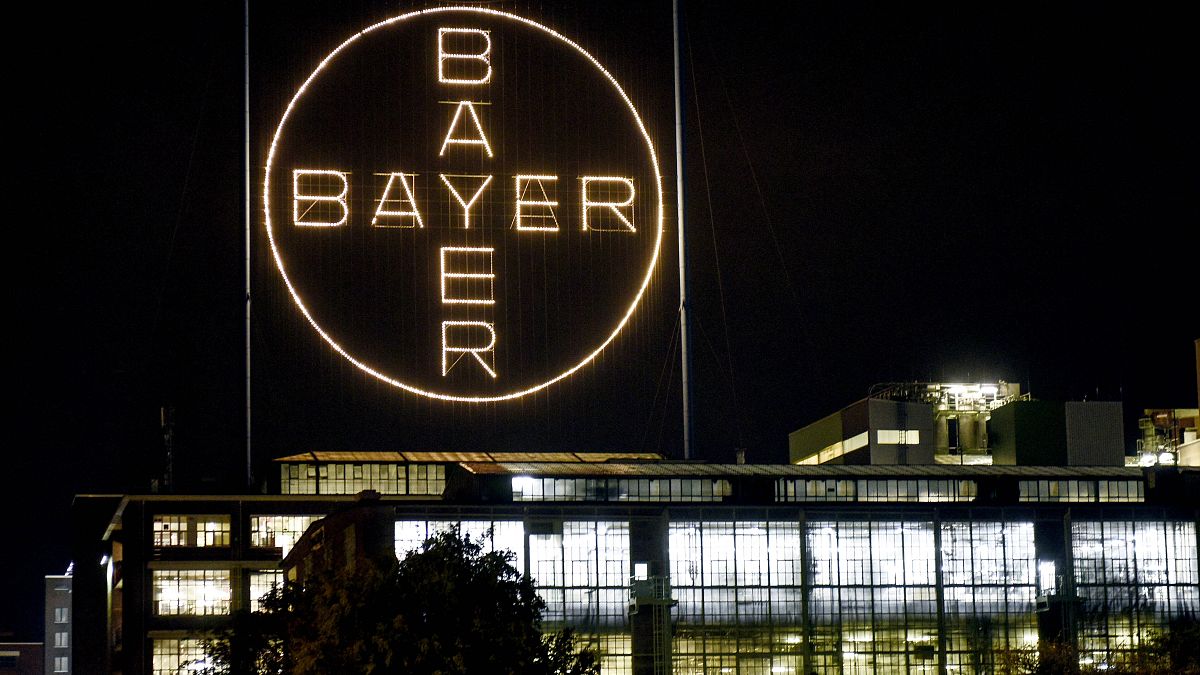 The Bayer logo shines at night at the main chemical plant of German Bayer AG on Thursday, Aug. 9, 2019 in Leverkusen, Germany.