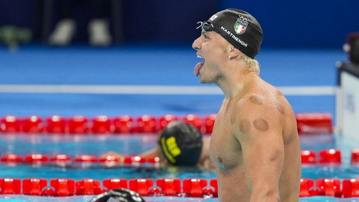 Nicolo Martinenghi, of Italy, celebrates after winning the men