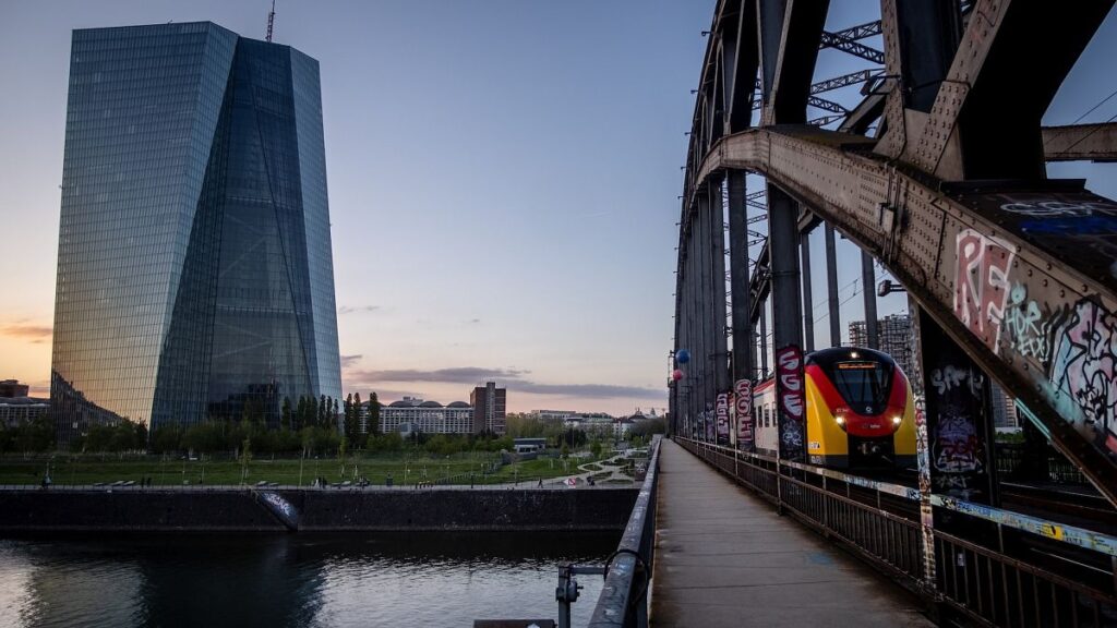 A tram drives past the European Central Bank building in Frankfurt, Germany