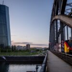 A tram drives past the European Central Bank building in Frankfurt, Germany