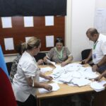 Members of an election commission count ballots at a polling station after a snap election in the Milli Mejlis parliament in Baku, Azerbaijan, Sept. 1, 2024