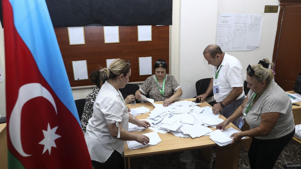 Members of an election commission count ballots at a polling station after a snap election in the Milli Mejlis parliament in Baku, Azerbaijan, Sept. 1, 2024