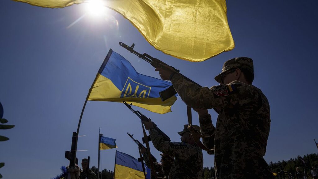 Honour guards shoot into the air during the funeral ceremony of six Ukrainian servicemen killed in a Russian rocket attack, September 7, 2024