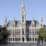 People walk in front of the City Hall in downtown Vienna.