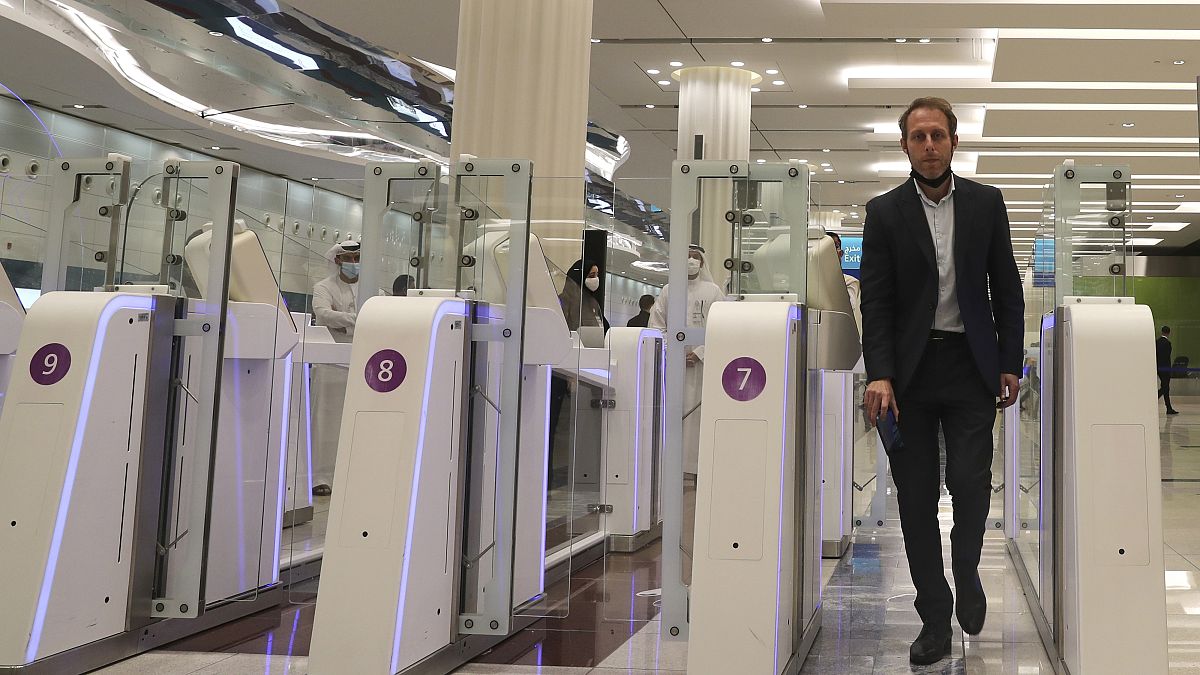 A man goes through an automated gate at Dubai Airport, in the United Arab Emirates, Sunday March 7, 2021.