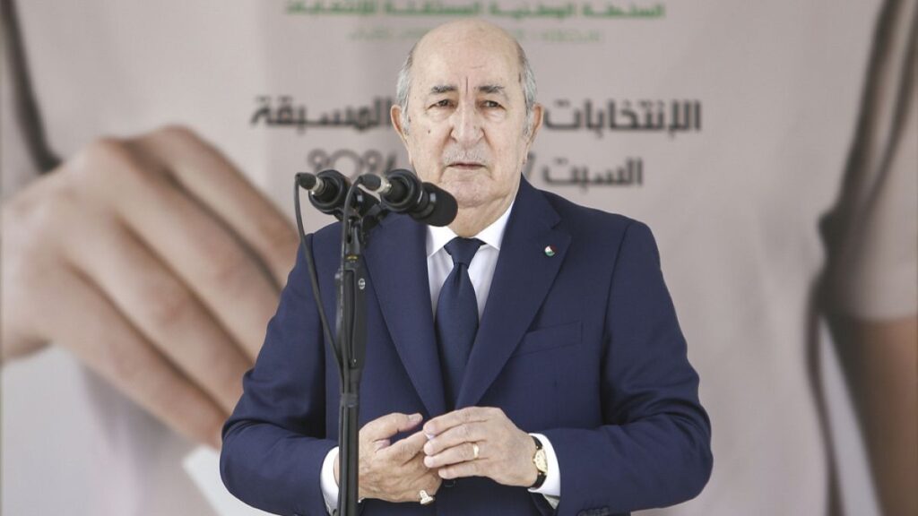 Algerian President Abdelmajid Tebboune speaks nside a polling station during the presidential elections, Saturday, Sept. 7, 2024, in Algiers, Algeria.