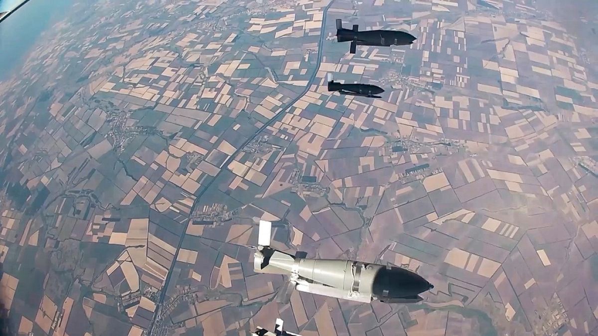 FILE - In this photo taken from video released by the Russian Defence Ministry on Aug. 21, 2024, glide bombs are released by a Russian warplane en route to their targets