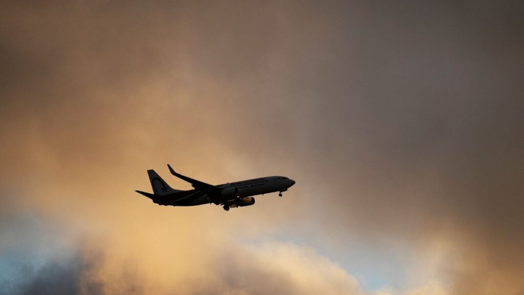 A Royal Air Maroc Boeing 737 approaches for landing in Lisbon at sunset, Saturday, July 20, 2024.