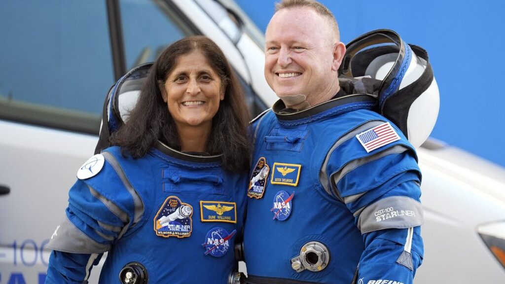 NASA astronauts Suni Williams, left, and Butch Wilmore stand together for a photo enroute to the launch pad.