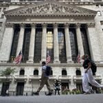 People pass the New York Stock Exchange on Wednesday, Sept. 4, 2024, in New York